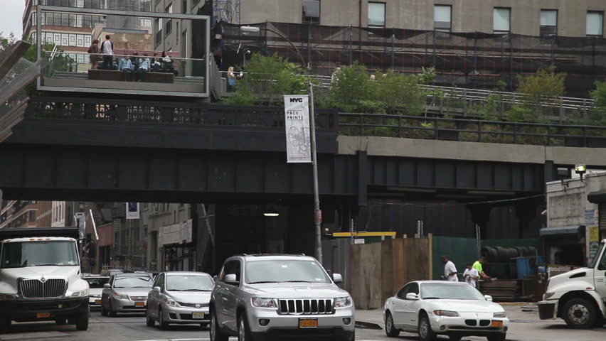 NEW YORK - OCTOBER 4: Traffic below the new Highline park, OCTOBER 4, 2011 in New York. he High Line is a 1-mile (1.6 km) New York City linear park built on a 1.45-mile section of the former elevated freight railroad spur called the West Side Line.