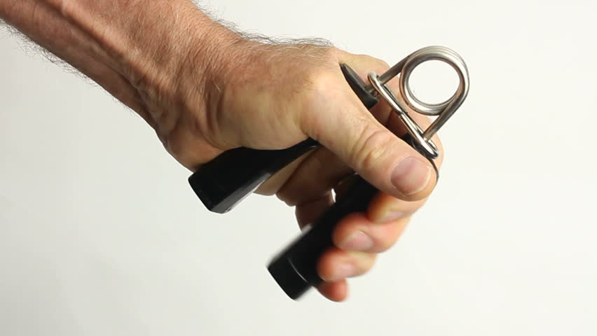 Man squeezes hand grip, strengthens muscles in hand, fingers, wrist, arm, as part of routine exercise workout, white background. 1080p