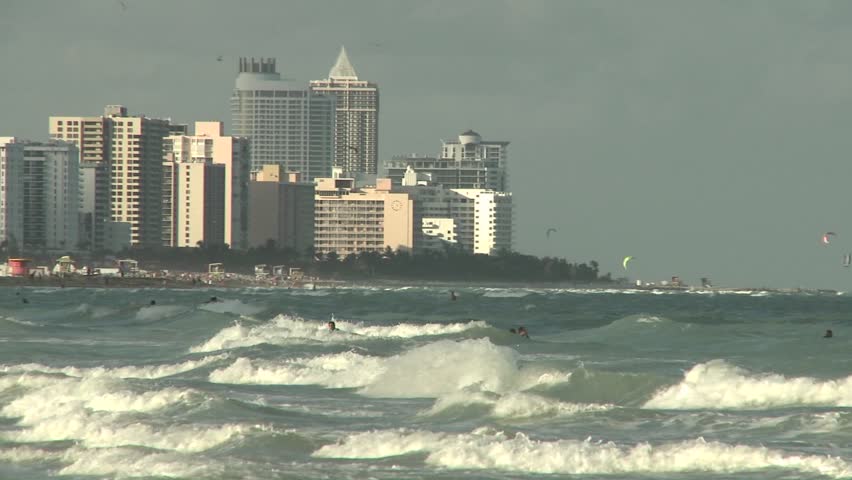 WS - Hotels along Miami Beach with rolling waves in foreground