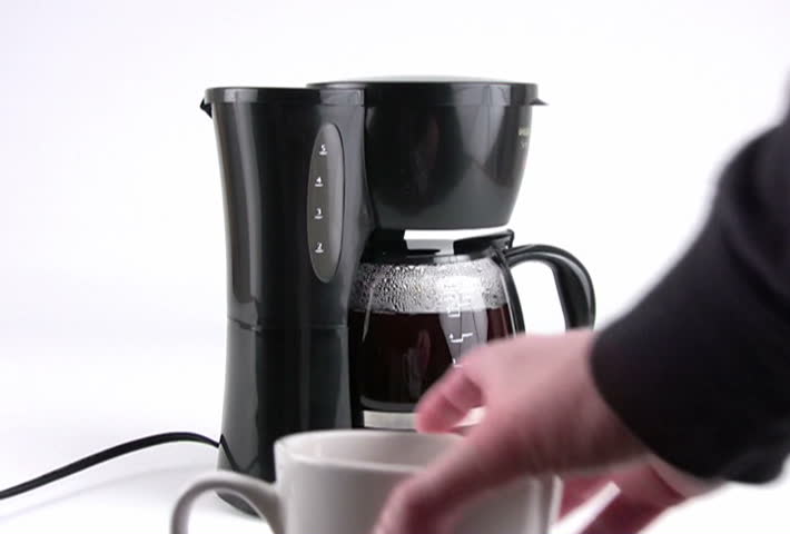 Pouring a cup of fresh hot coffee. Converted to NTSC from HDV 1080i60.