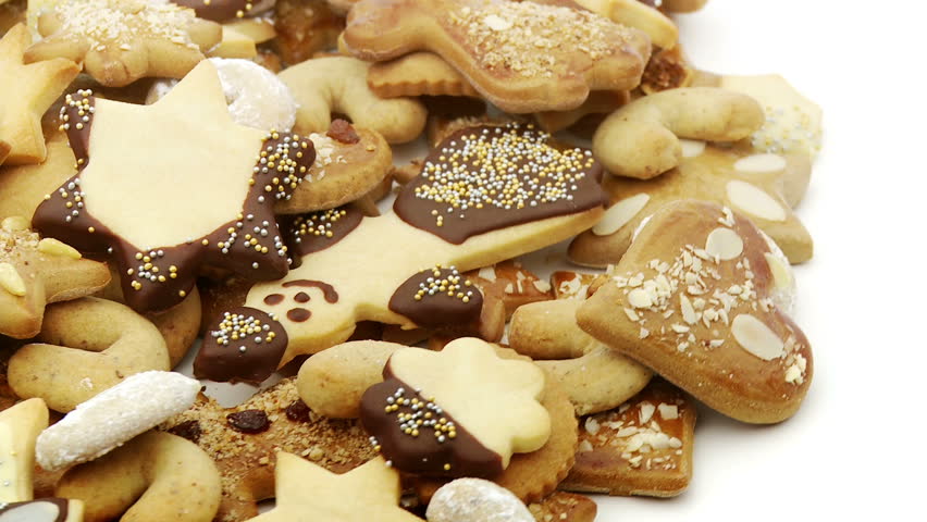 santa claus, stars and other christmas cookies looping on white