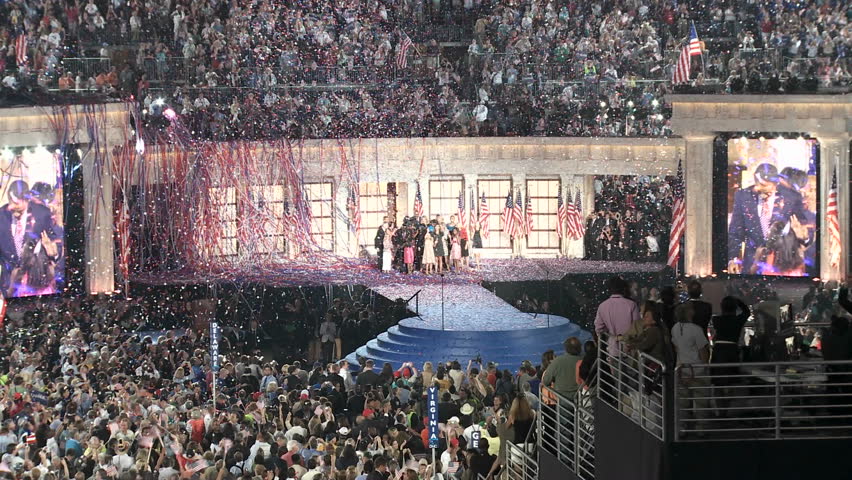 DENVER, COLORADO - CIRCA 2008: Presidential Nominee Barack Obama and his Vice Presidential pick Joe Biden celebrate with their families as confetti falls at the end of the 2008 Democratic National Convention.