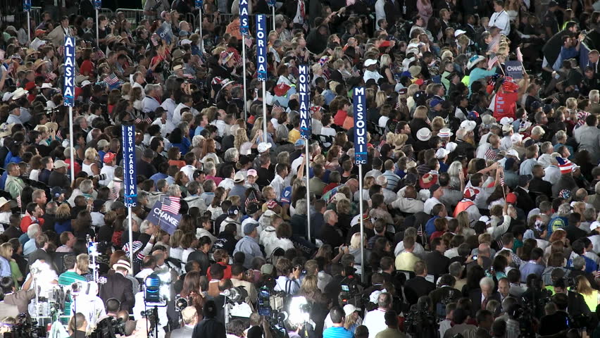DENVER, COLORADO - CIRCA 2008: Delegates stand and cheer as Presidential Nominee Barack Obama delivers his acceptance speech during the final night of the 2008 Democratic National Convention.