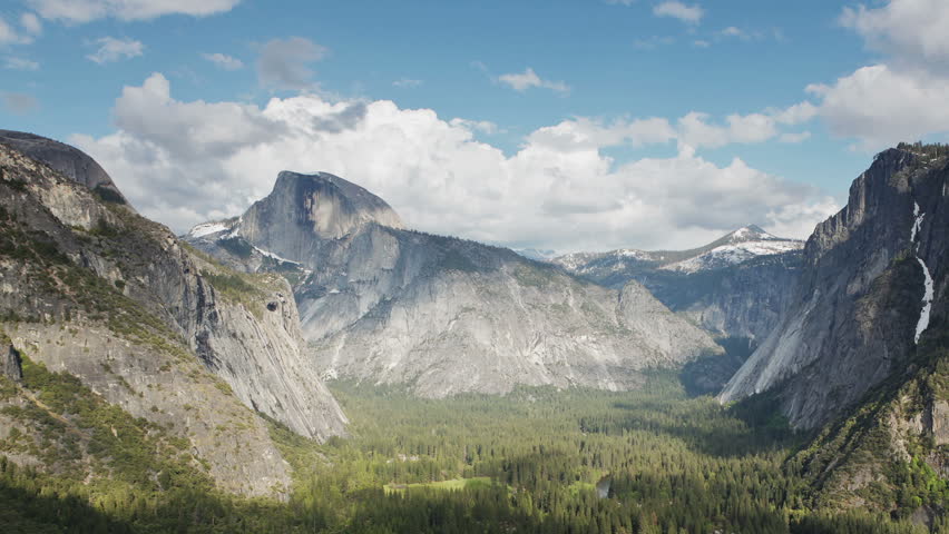 Yosemite Valley with Half Dome and Glacier Point visible in the distance (time-lapse)
