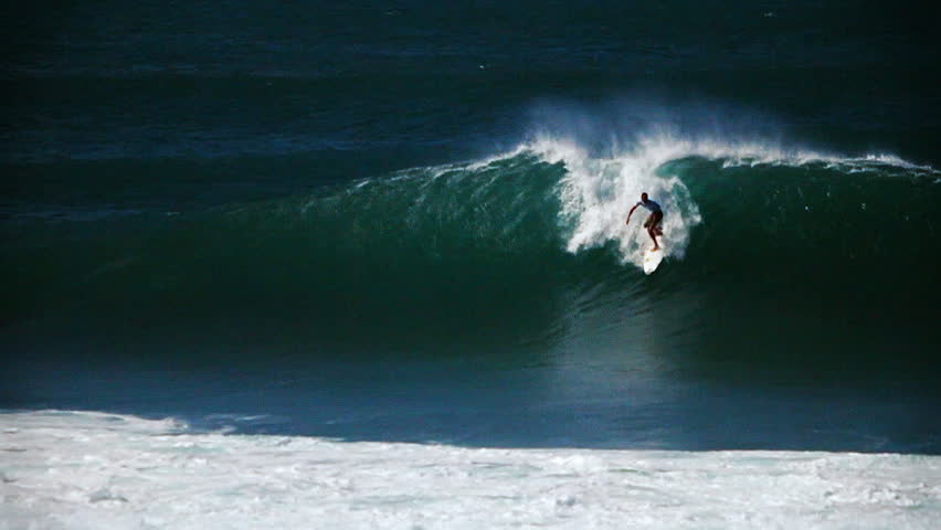 surfer riding the waves
