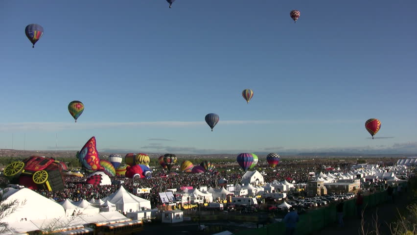 ALBUQUERQUE, NM - OCTOBER 8: Crowds cheer hot air balloon flight crews during the International Balloon Fiesta in Albuquerque, NM on October 8, 2011