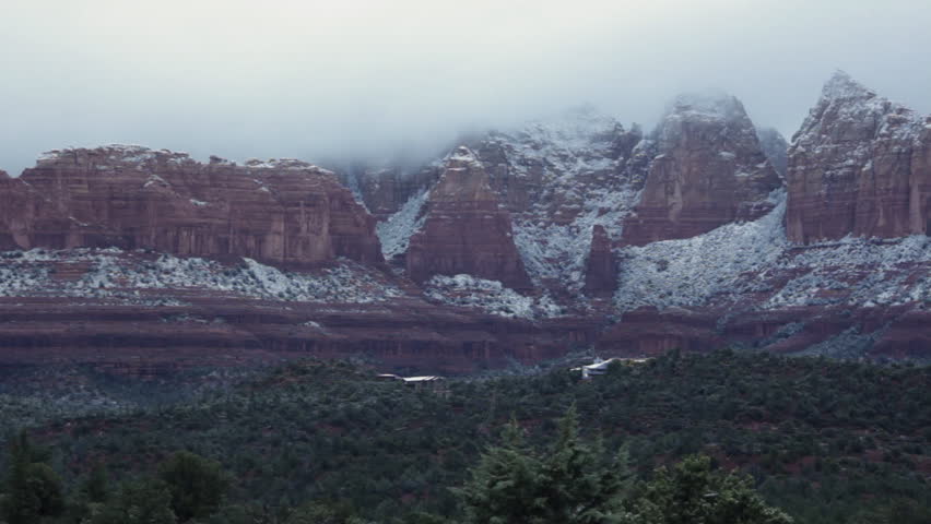 Heavy, misty, morning clouds hang over the Sedona landscape after a light dusting of the first snow of the season.