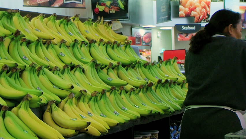 Woman Stocking Bananas 