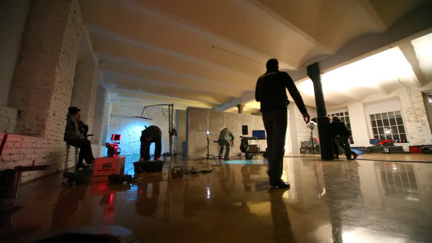 In dark studio scenery and equipment for shootings are put