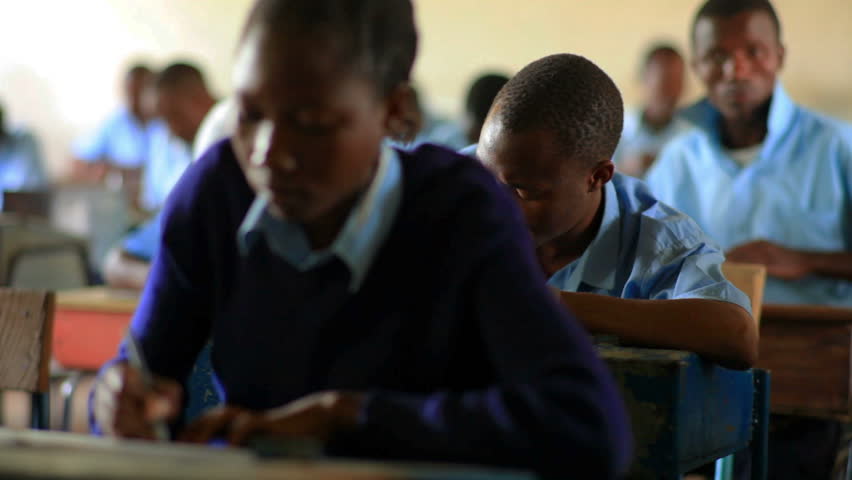 KENYA, AFRICA - AUGUST 2010: Students taking a test in class in a school in a village in Kenya two hours north of the African city Mombassa on Aug 2010 in Kenya.
