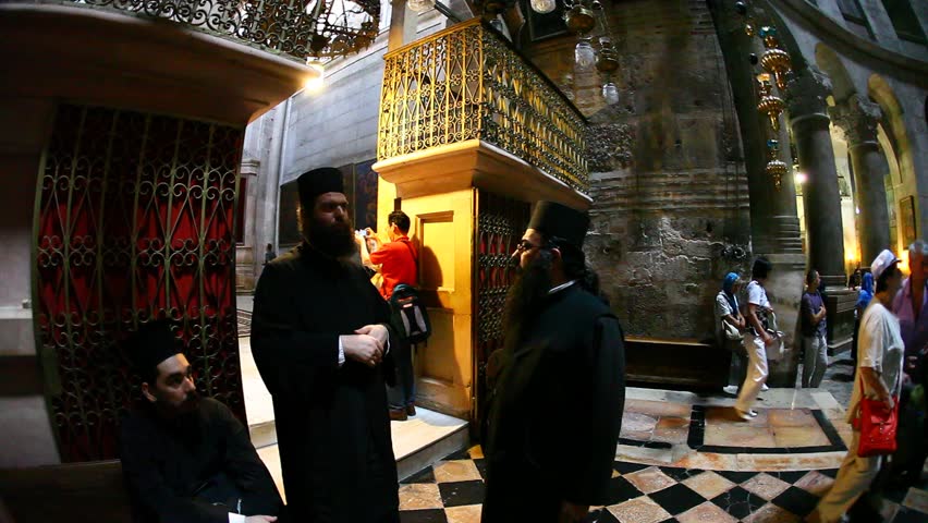 JERUSALEM, ISRAEL - CIRCA OCT 2011: Three priests have a conversation in the Church of the Holy Sepulchre circa October 2011 in Jerusalem.