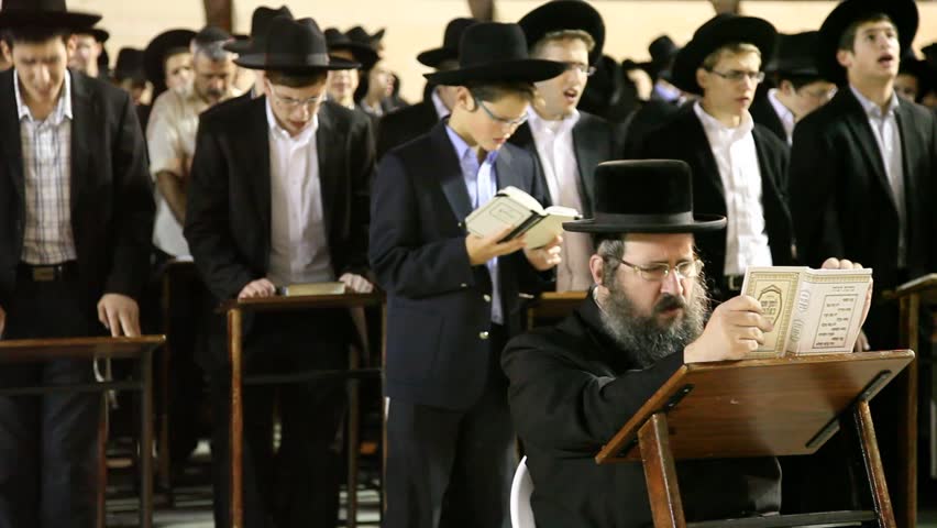 JERUSALEM, ISRAEL - OCT 6, 2011: Yeshiva students pray during Slihot at the Western Wall on October 6, 2011 in Jerusalem.