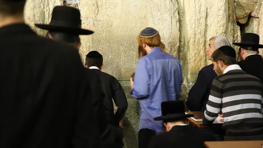 JERUSALEM, ISRAEL - OCT 6, 2011: Yeshiva students pray during Slihot at the Western Wall on October 6, 2011 in Jerusalem.