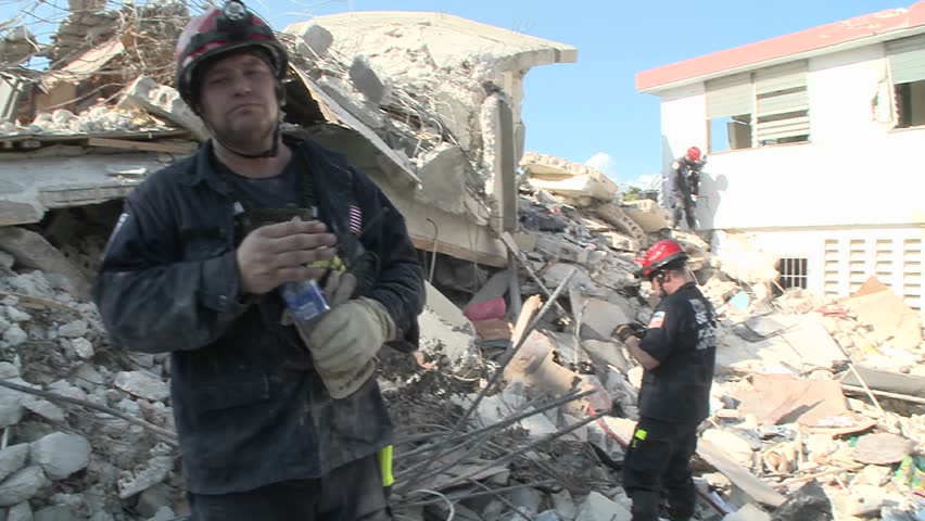 PORT-AU HAITI - CIRCA 2010: rescue units investigate destroyed building circa 2010 in Haiti.