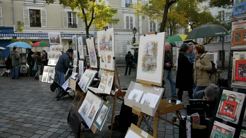 PARIS - CIRCA NOVEMBER 2011 Artists sell paintings in front of cafes at the Place du Tertre Paris Montmartre Paris,France, circa November 2011.  