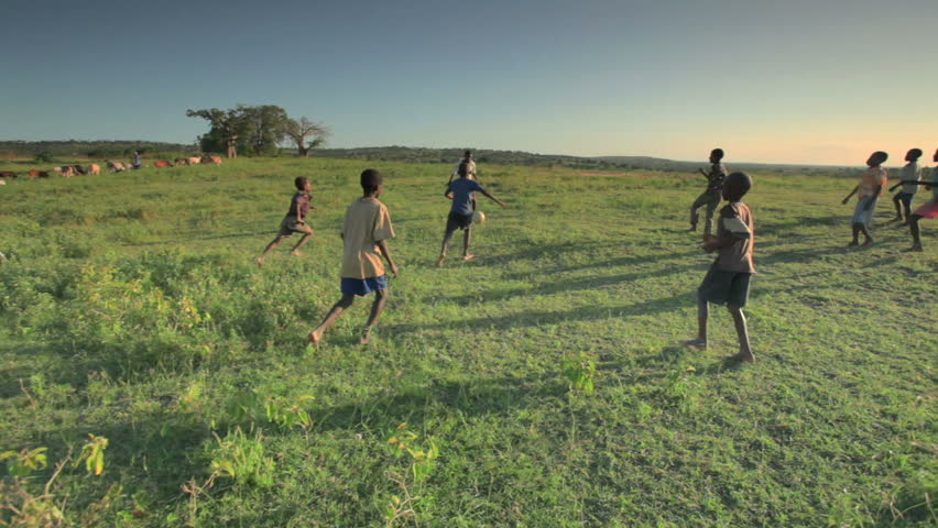 KENYA, AFRICA - CIRCA 2011:  Children playing soccer on the fields in Kenya, Africa.