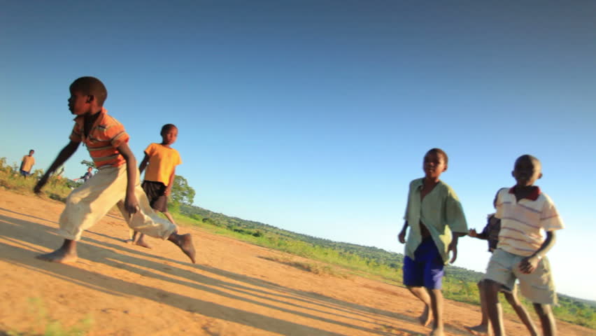KENYA, AFRICA - CIRCA 2011:  Children playing soccer on the fields in Kenya, Africa.