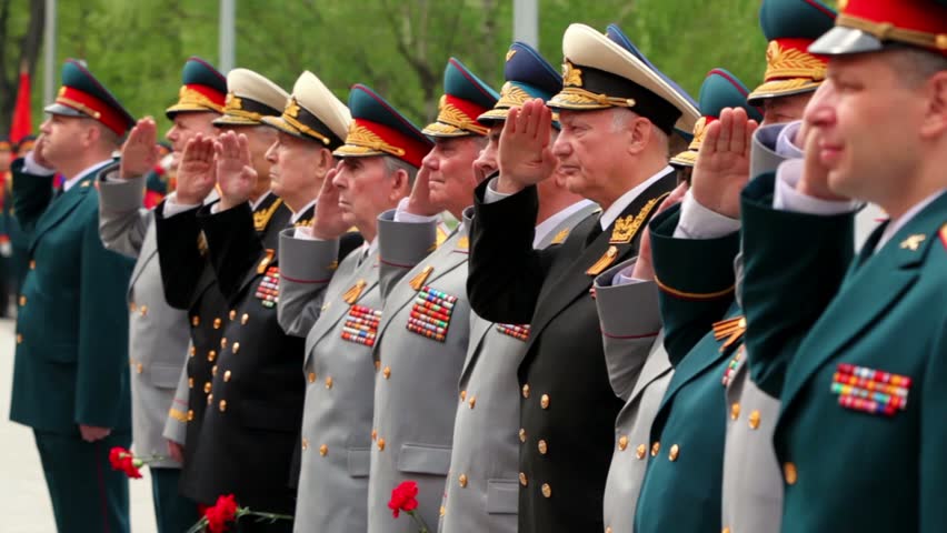 MOSCOW - MAY 8: High command veterans stand in row and salute at wreath laying ceremony, Unknown Soldiers grave in Alexander Garden on May 8, 2011 in Moscow, Russia 