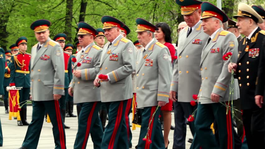 MOSCOW - MAY 8: High command walk with flowers on wreath laying ceremony, closeup view on May 8, 2011 in Moscow, Russia