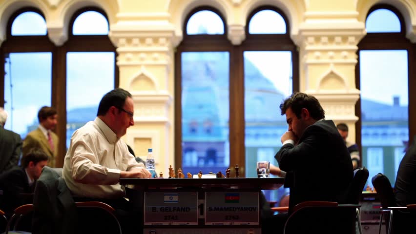 MOSCOW - NOVEMBER 4: Boris Gelfand (Israel, 42) 2741 and Shahrijar Mamedjarov (Azerbaijan, 25) 2763 play on Michael Taljas fifth chess memorial  at GUM, on November 4, 2010 in Moscow, Russia.