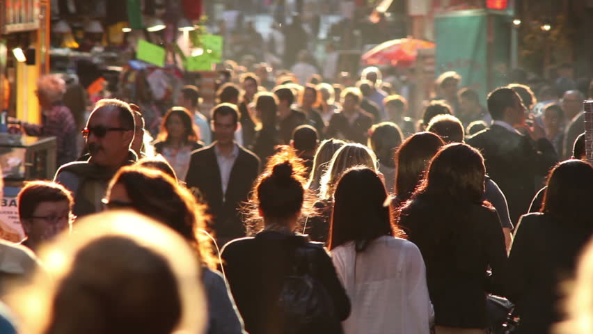 PARIS - JUNE 2011:  Tourists fill the crowded Latin Quarter in Paris with late afternoon sun