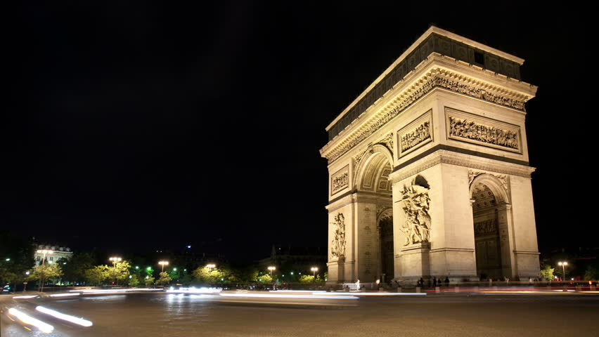 Timelapse at night Arc de Triomphe as traffic passes by