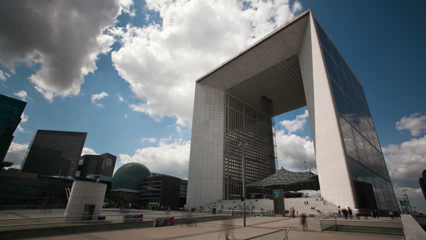 PARIS - JUNE 2011: Business people in front of La Grand Arched in La Defense district of Paris