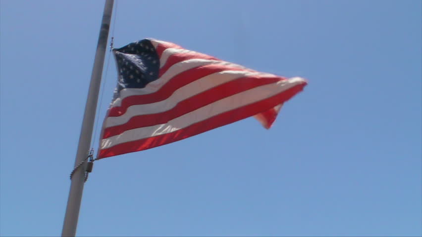 Slow Motion USA American Flag at half mast.