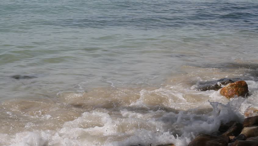 Tidal bore, a wave rolled on the rocks