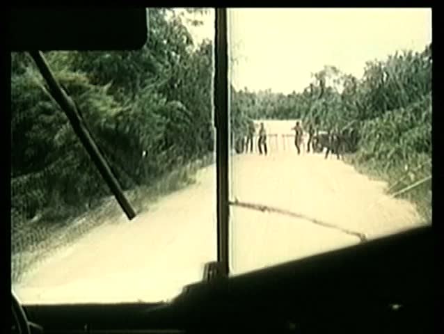 View from inside bus running through military checkpoint