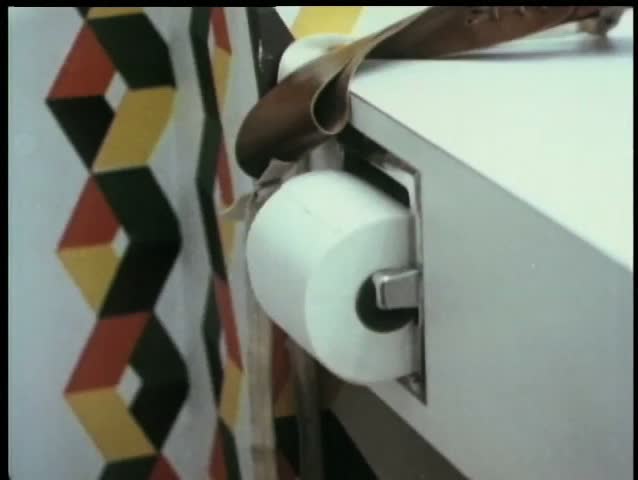 Close-up  man pulling out a large amount of toilet paper