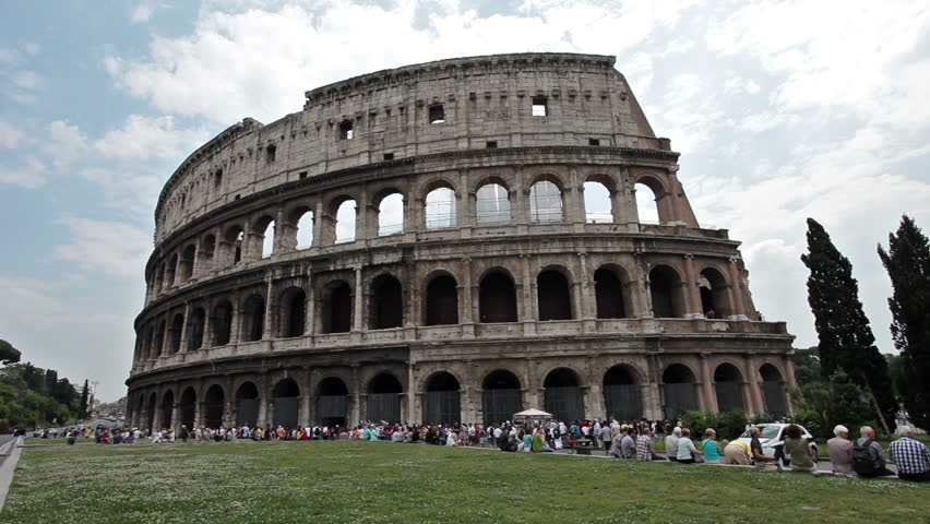 ROME, ITALY MAY 25 2011: Spectators visit the famous Roman Colosseum in Rome. Vacation destination in Europe and the Euro Zone during economic downturn and problems.