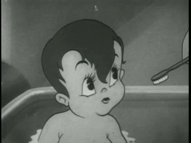 Baby boy in tub does not want to brush his teeth