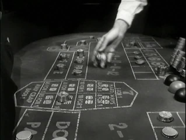 Rolling dice on craps table