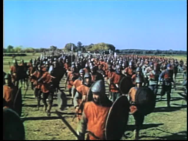 Wide shot medieval bow and arrow warfare on battlefield