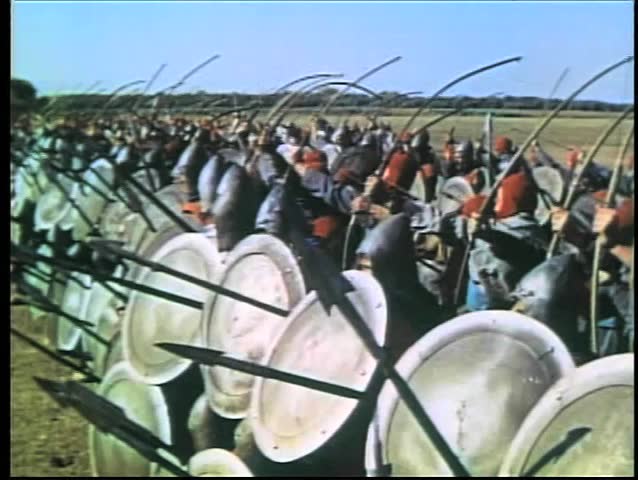 Medieval soldiers shooting arrows at opposition on battlefield