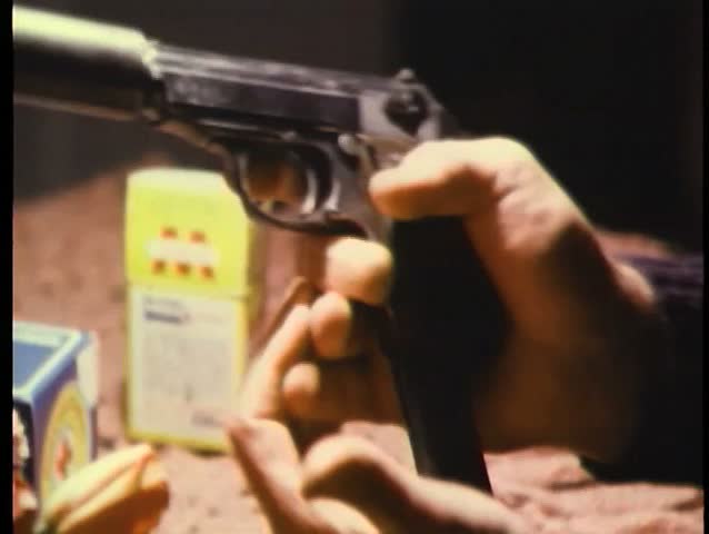 Hands loading gun with silencer
