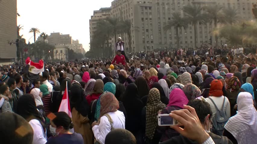 CAIRO, EGYPT - NOV 19: Young protesters in Tahrir Square chant slogans on November 19, 2011 in Cairo, Egypt.