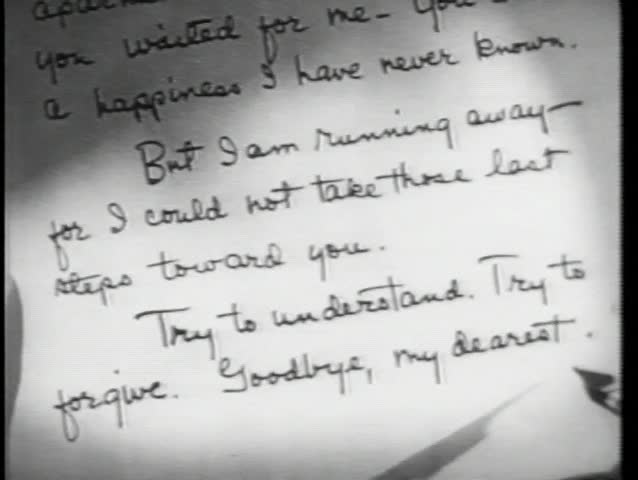 Close-up of hand writing 'Dear John' letter then crumpling it up