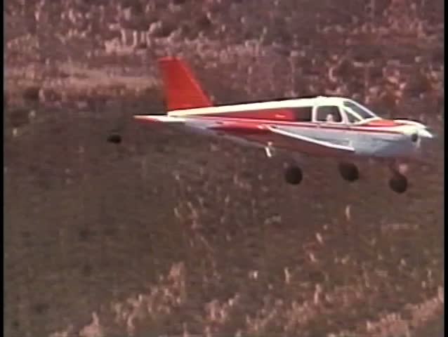 Small plane flying above mountains in South Africa