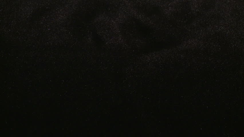 American coins dropping into frame with black background