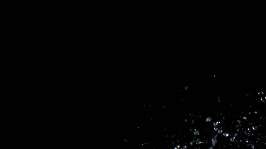 Slow-motion rain size droplets against black drop shooting with high speed camera, phantom flex.