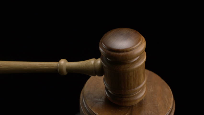 Gavel pounded on block
