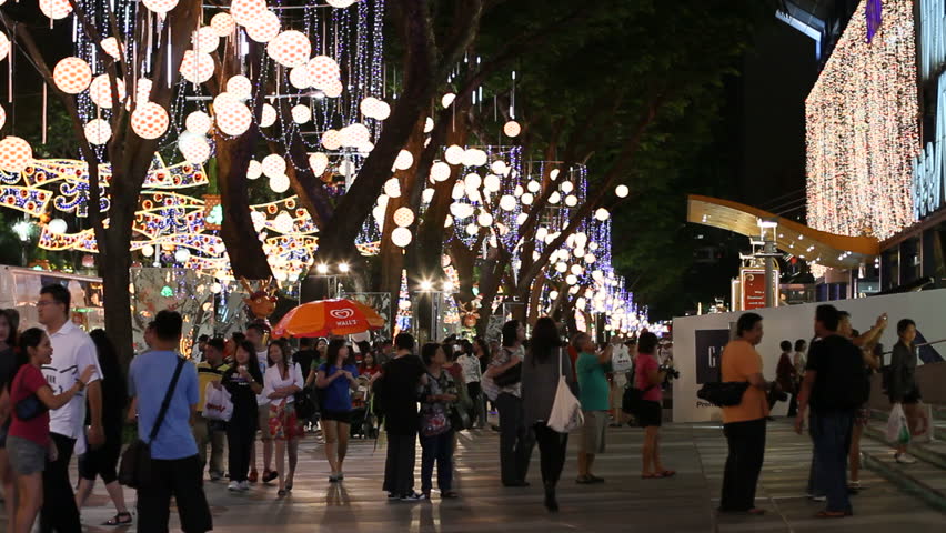SINGAPORE - NOVEMBER 16: The emblematic Orchard Road at night, filled with mainly local people who enjoy its famous lavish Christmas light-up on November 16, 2009 in Singapore.