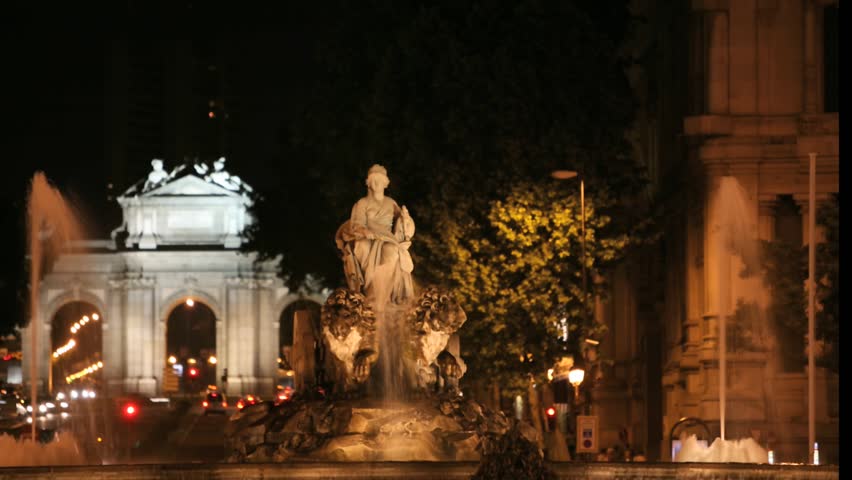 Seamless looping high definition time lapse video of the Plaza de Cibeles in Madrid, Spain at night.  With Cibeles Fountain and the Puerta de AlcalÃÂ¡ in the background.