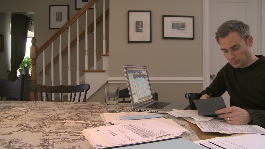 Man working on bills and finances