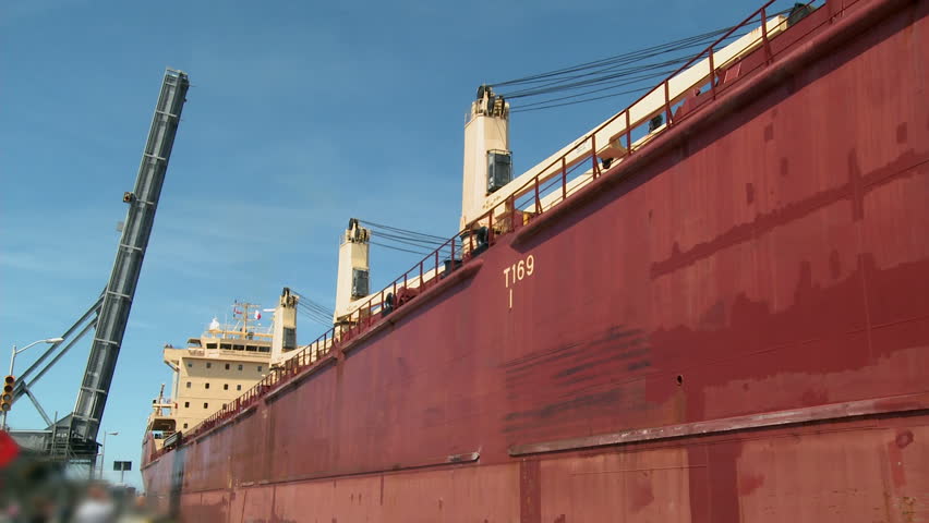 Time-Lapse of Lake Freighter or Cargo ship, moving slowly along the Welland Canal after just leaving Lock No. 1 on it's way towards Lake Erie.