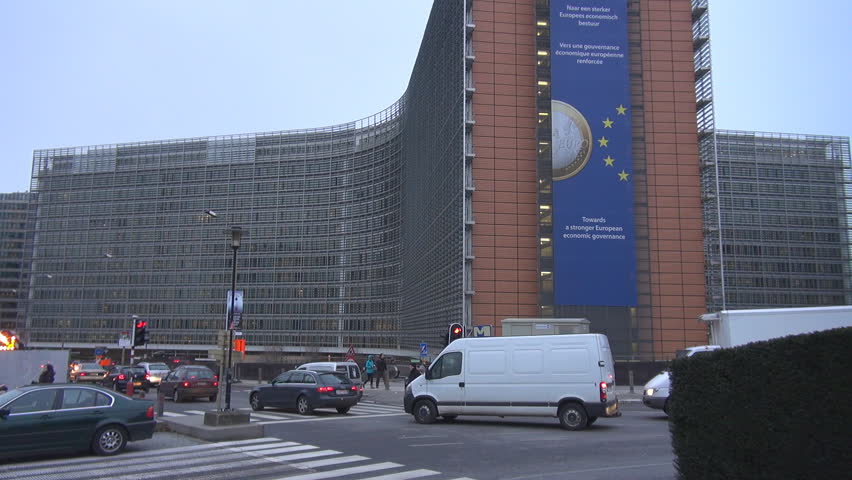 BRUSSELS, BELGIUM - DECEMBER 19, 2011: Vehicles pass European Commission