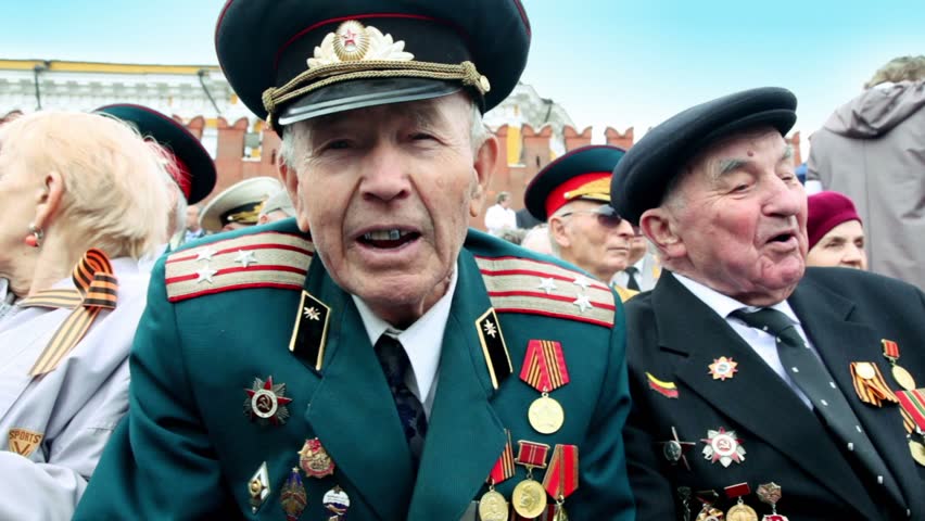 MOSCOW - MAY 9: Veteran Shishkin V.I. speak about war at background of Kremlin wall on May 9, 2011 in Moscow, Russia.
