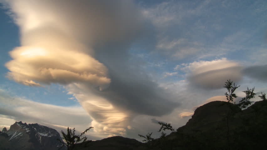 Fantastic spiral clouds at sunset. Andes, Chile. Interval record. Tripod 